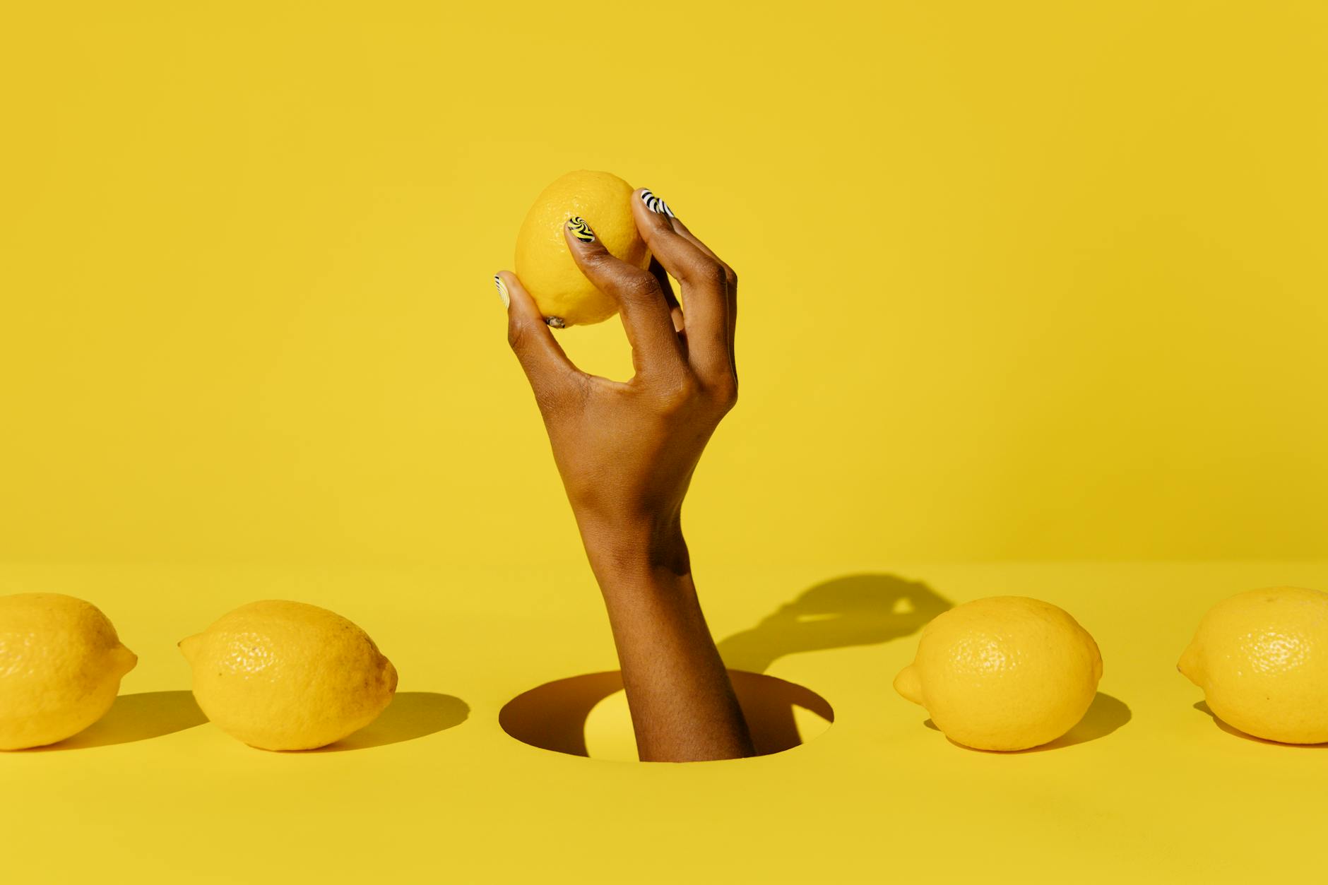 Two hands holding colorful vibrators together, representing open communication about pleasure